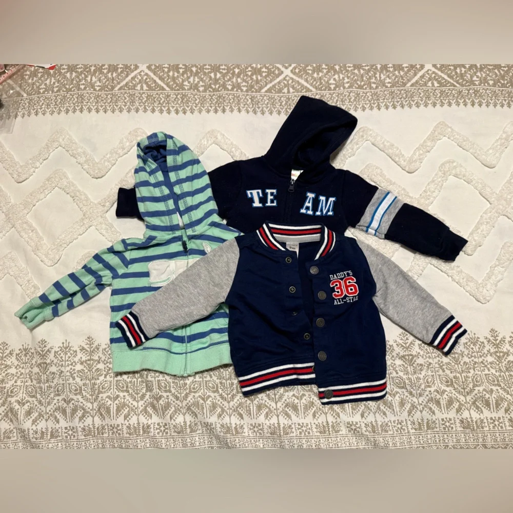 Set of three jackets two Carter’s (9 and 6 months) and one Kidgets (0-6 months)
